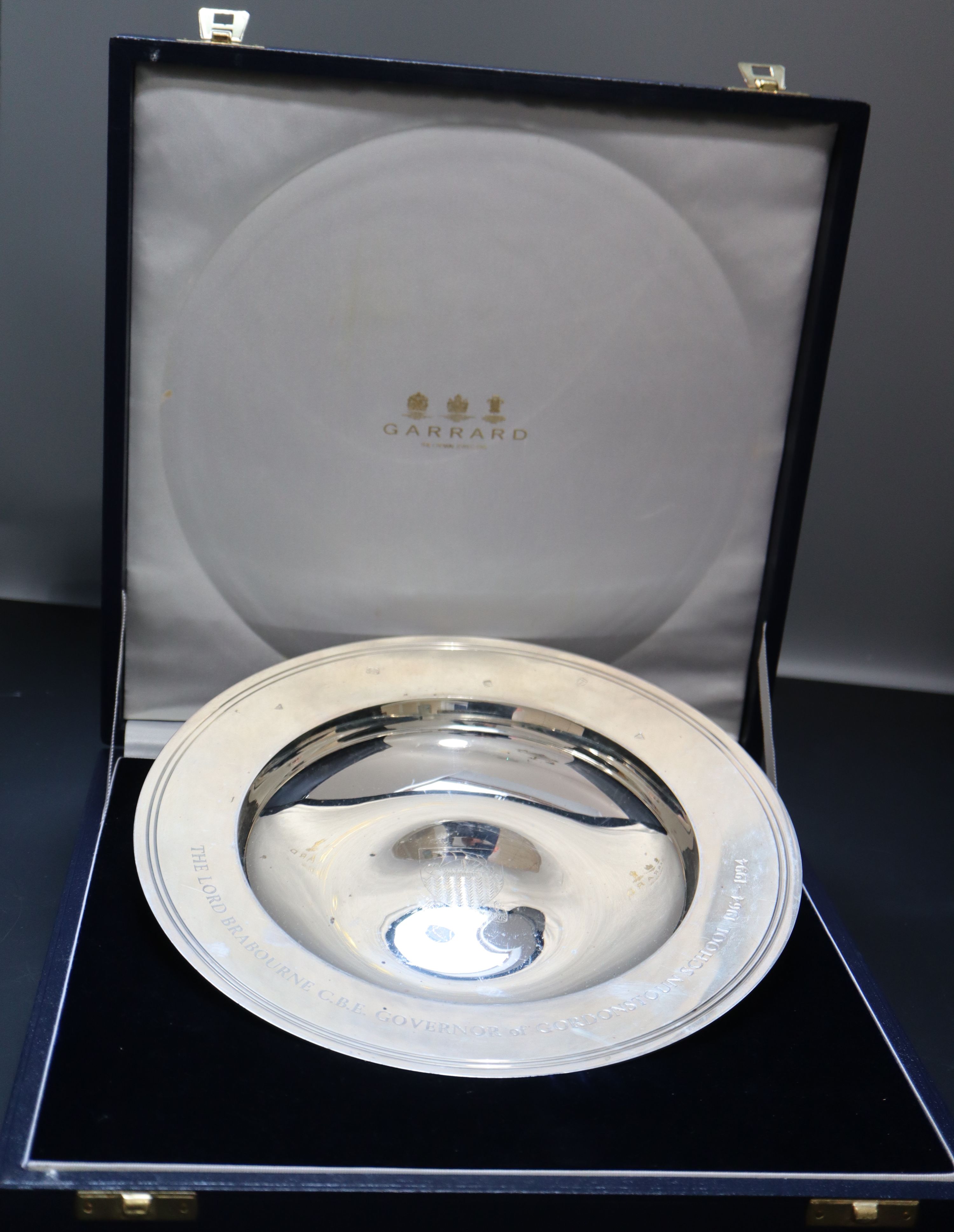 A cased modern silver Armada dish, 29.3cm, 34.5oz, in Garrards presentation case.